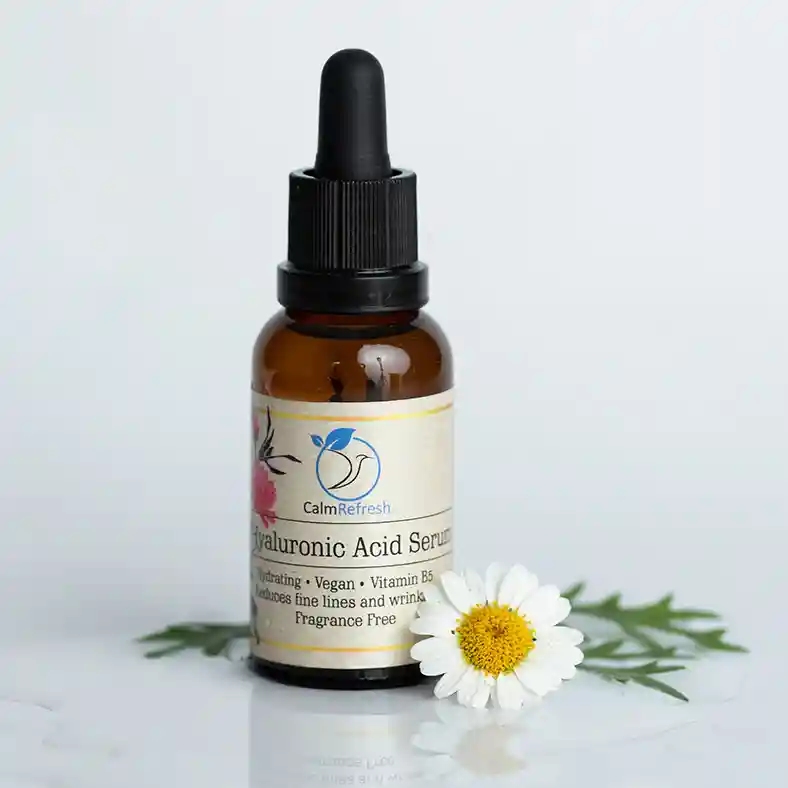 Hyaluronic Acid with single white daisy on one side of bottle